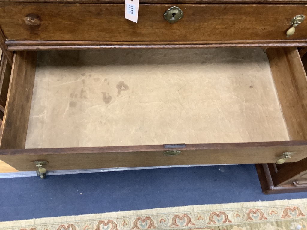An 18th century oak chest on stand, width 105cm, depth 56cm, height 134cm